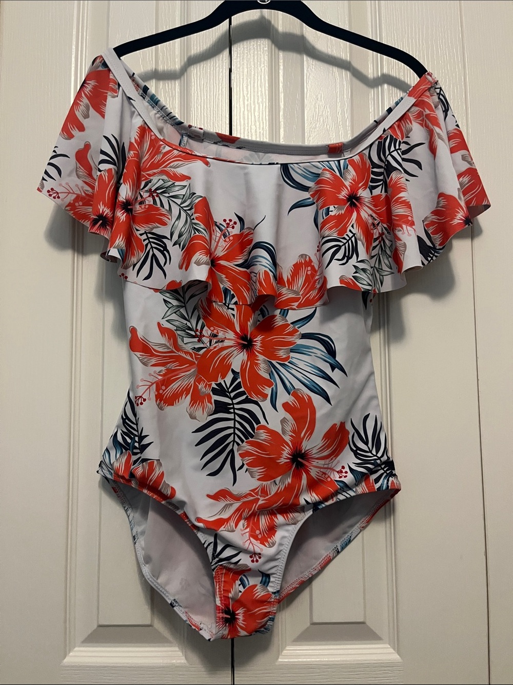 White and orange one piece bathing suit. Size medium